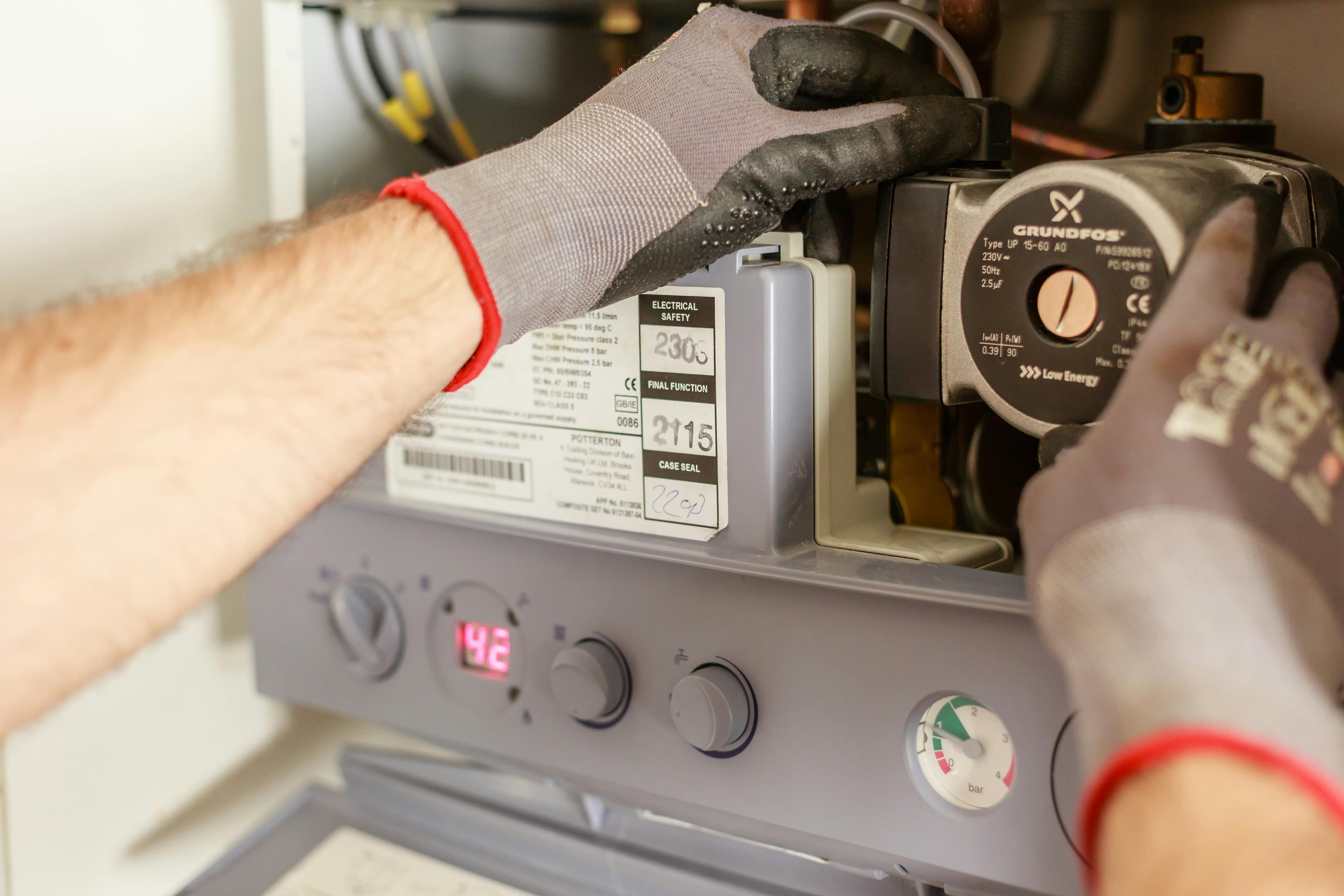 Furnace repair technician at work